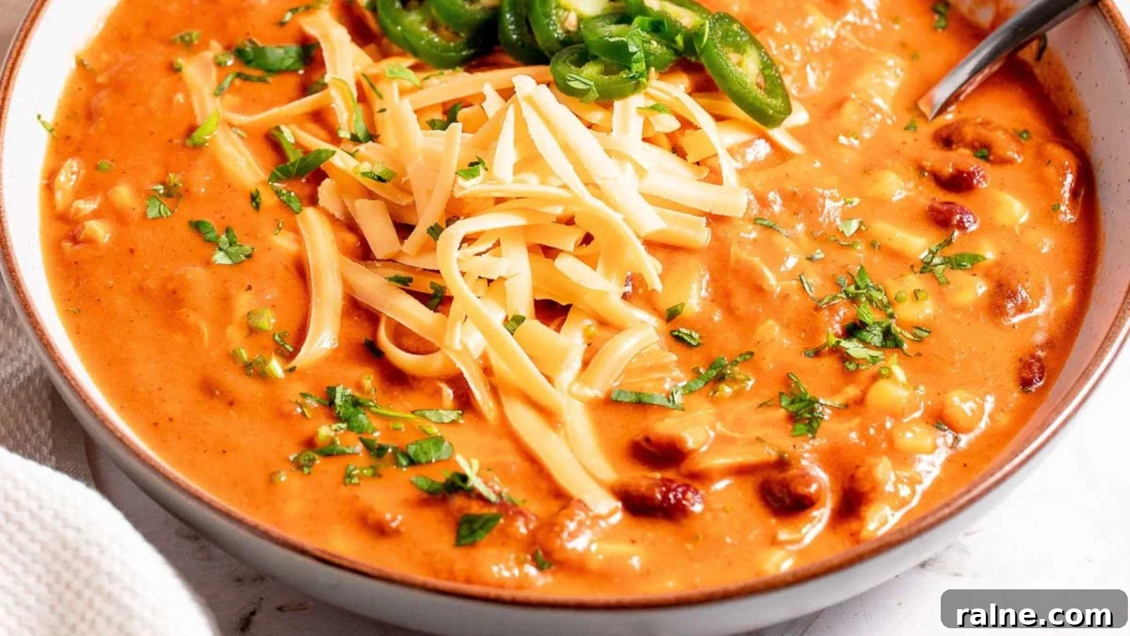17 Comforting Soup Recipes for Quiet Evenings 7 Chicken enchilada soup with shredded chicken and tortilla strips in creamy broth.