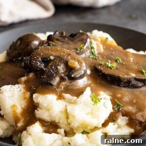 Creamy Mushroom Gravy Recipe for Roasts and Mashed Potatoes 8 Close up of gravy over mashed potatoes.