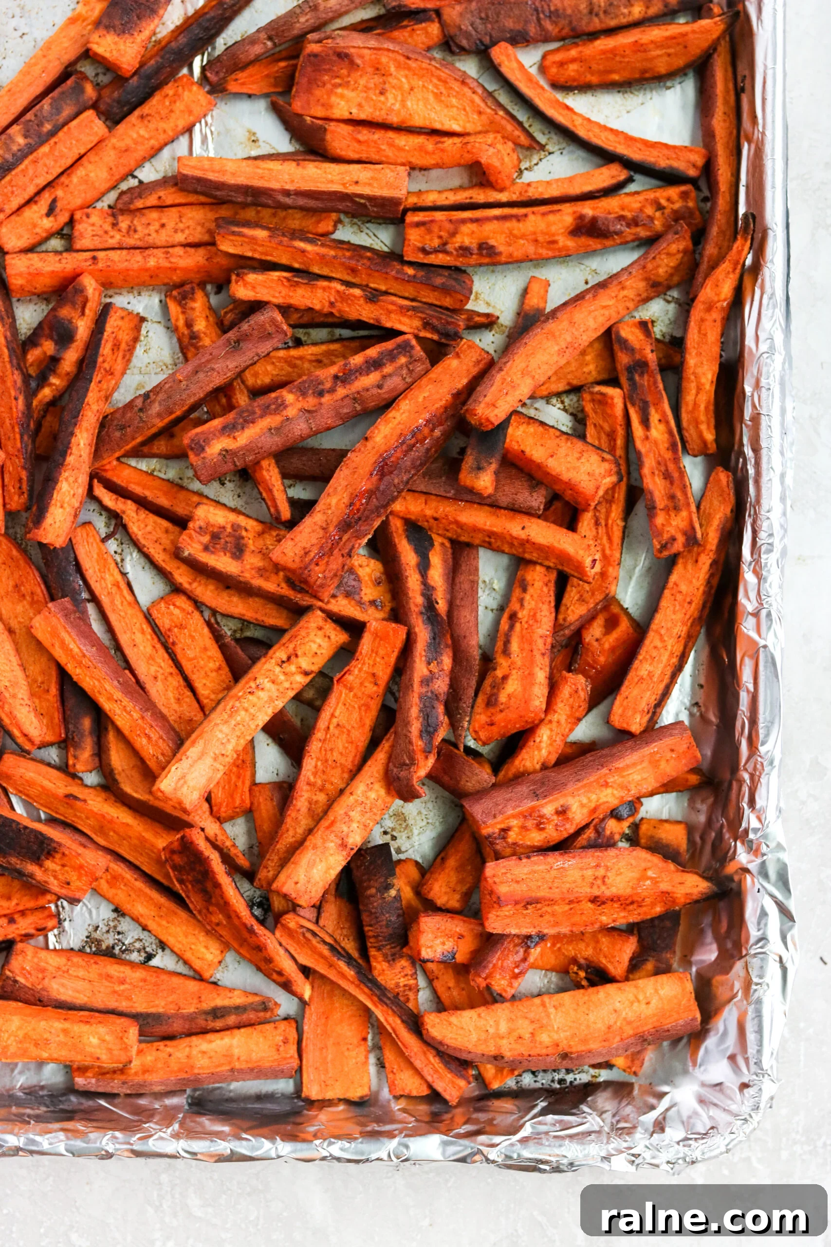 Instant Pot BBQ Chicken Bowls with Tangy Coleslaw Recipe 6 homemade sweet potato fries on a line baking sheet