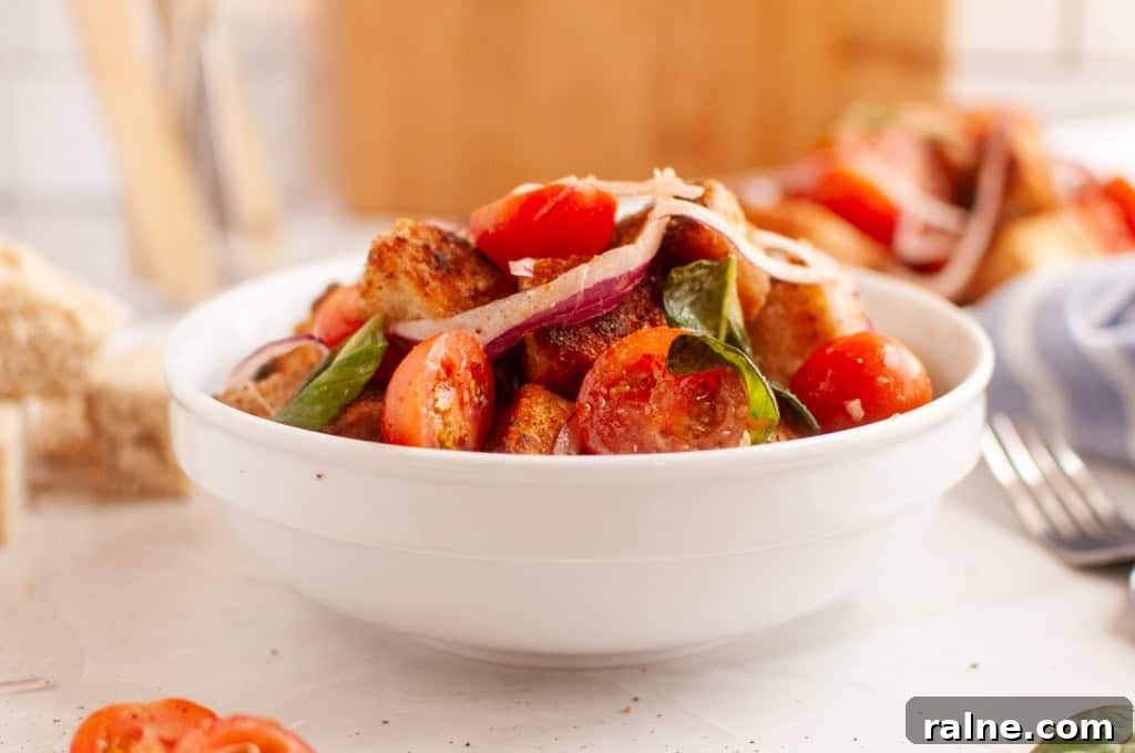 23 Make-Ahead Salads That Stay Fresh in the Fridge and Lunch Bag 17 A white bowl filled with Old-Fashioned Panzanella Salad.