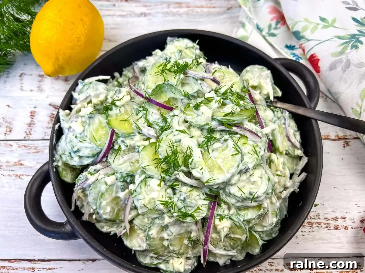 23 Make-Ahead Salads That Stay Fresh in the Fridge and Lunch Bag 8 Cucumber and Feta salad in a black bowl.