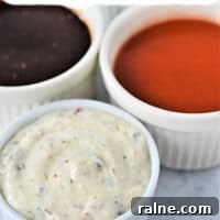 Top-Rated Dipping Sauces for Chicken Wings: Flavor Ideas and Pairings 12 Three bowls of dipping sauce for chicken wings: buffalo, barbeque, and creamy herb resting on a gray surface with Wing Sauces text above.