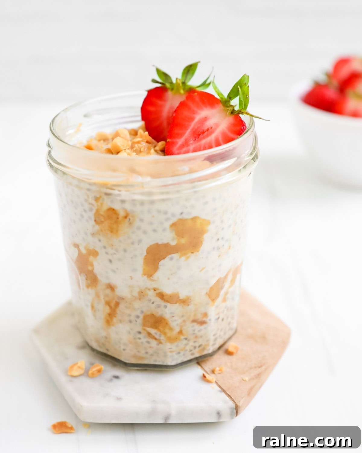 A glass cup filled with peanut chia pudding.