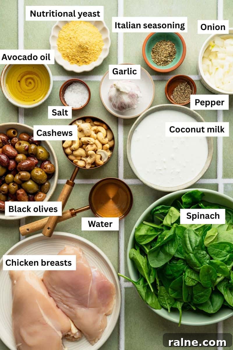 The ingredients needed to make chicken Alfredo separated into bowls including chicken, milk, seasonings, garlic and nutritional yeast.