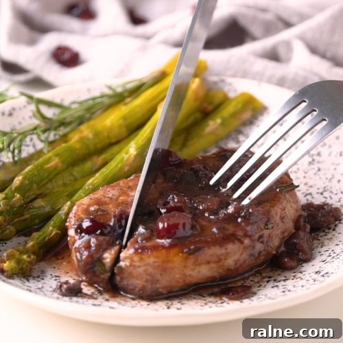 These Skillet Pork Chops are juicy, tender and easy to make. Boneless pork chops are seasoned with fresh rosemary, seared to perfection and topped with the tastiest Port wine and cranberry pan sauce.